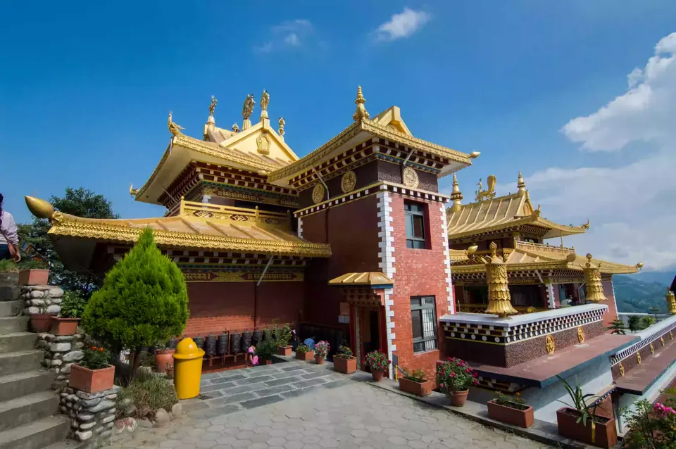 Namo Buddha Monastery with prayer flags on a quiet hilltop