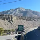 Dirt road winding through the dry Upper Mustang landscape on the way to Lo Manthang